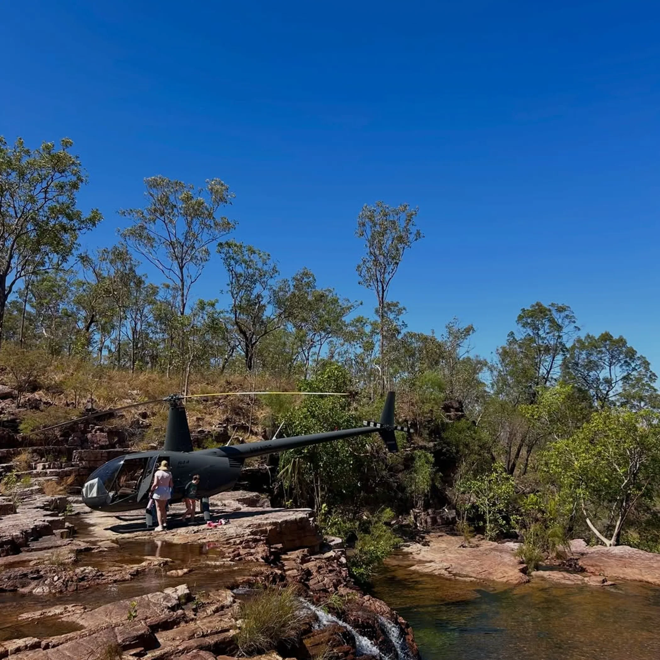 litchfield national park with helicopter and visitors